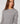 Maglione a maniche lunghe con peplo - Grigio